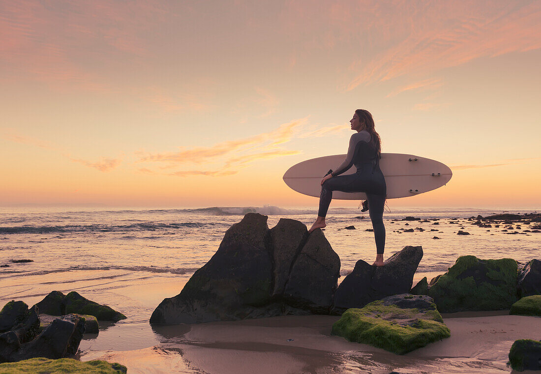 Spain, Andalusia, Cadiz, Costa de la Luz, Surfer on beach; Tarifa