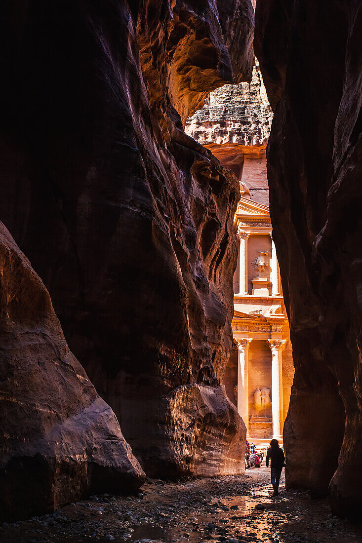 Jordan, El Khazneh seen from natural narrow canyon; Petra