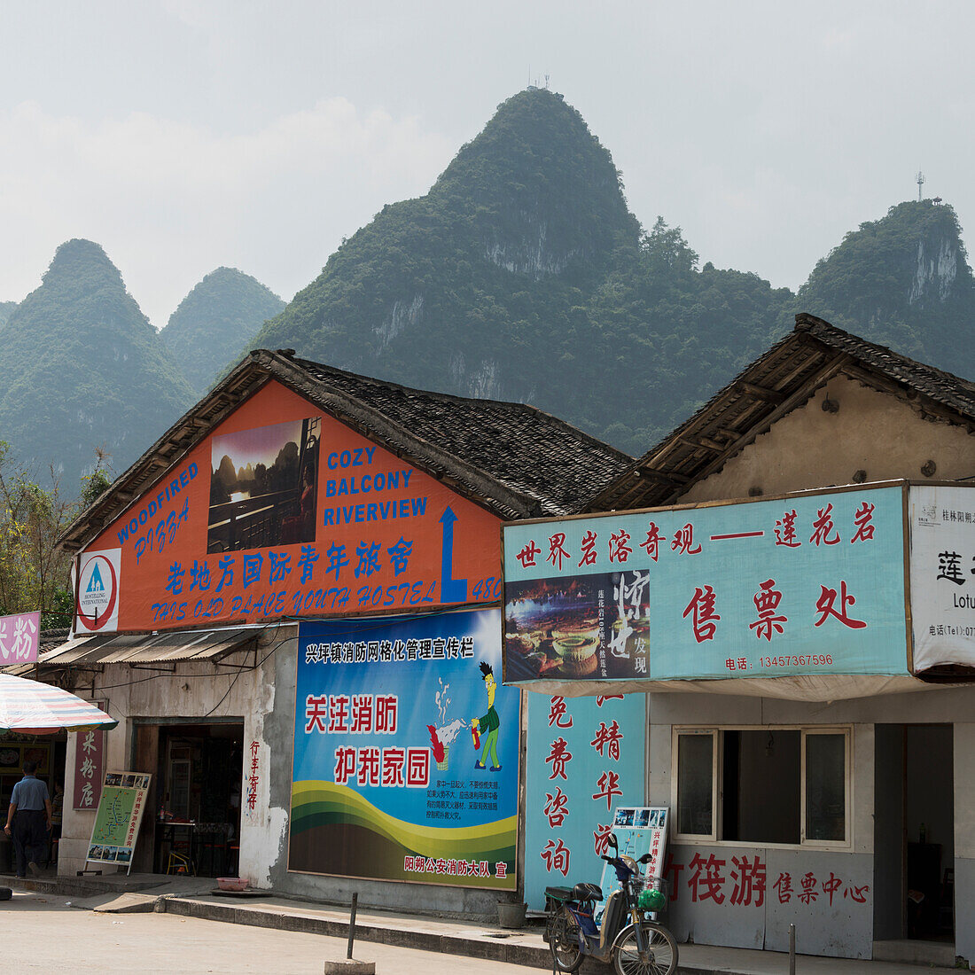 Buildings Covered With Colourful Advertising; Guilin, Guangxi, China