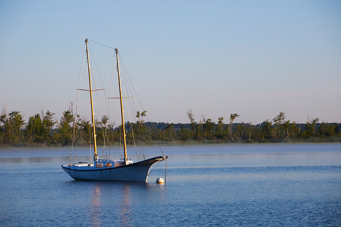 Old Sailboat In Early Morning Light On Brome Lake; Knowlton, Quebec, Canada