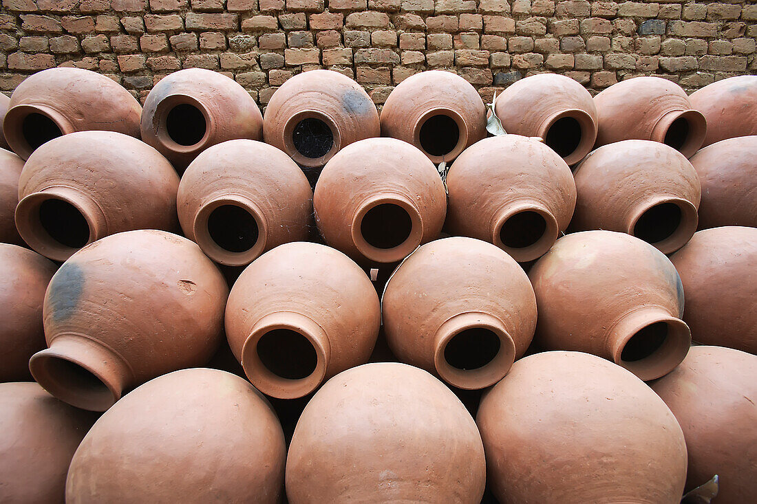Handmade Traditional Ceramic Water Pots Lying Upurchased Beside A Kiln; India