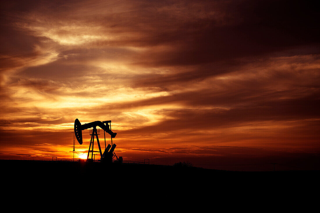 Pump Jack in Oilfield at Sunset, Saskatchewan, Canada