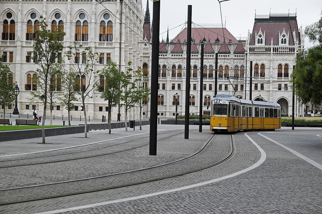 Tram by Hungarian Parliament Building on Rainy Day, Budapest, Hungary
