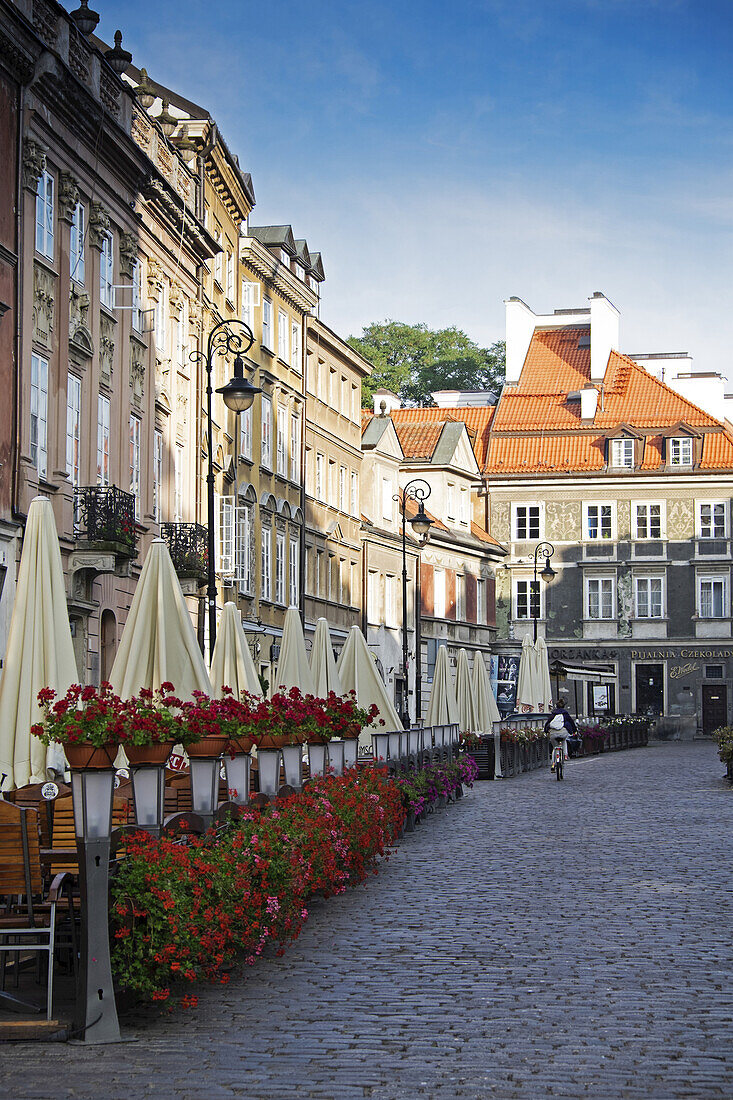 Buildings along cobblestone street, Old Town, Warsaw, Poland.