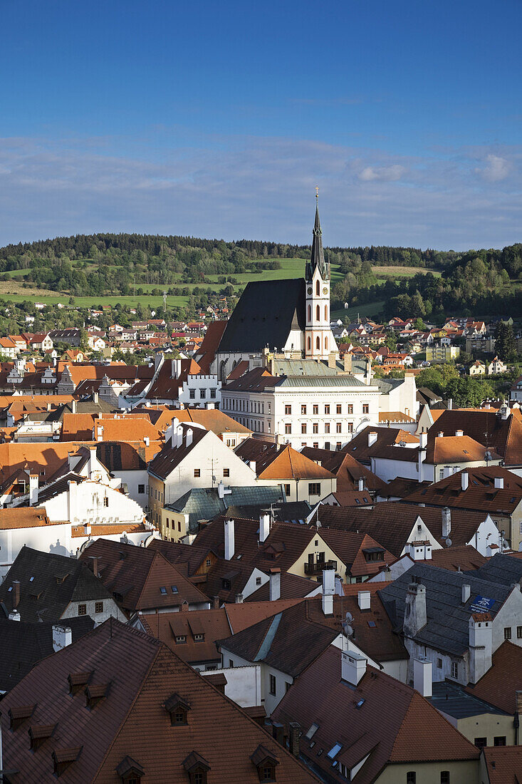 Overview of city and rooftops with St Vitus Church, Cesky Krumlov, Czech Republic.