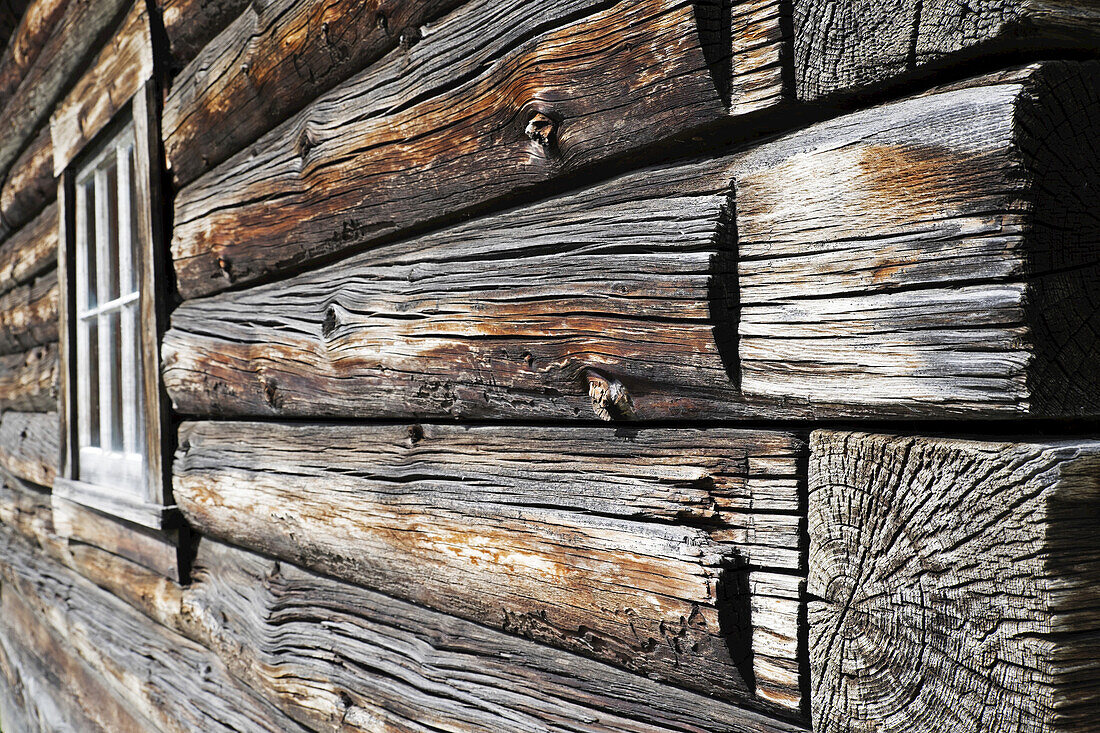 Close-up of weathered logs on traditional wooden building at Barkerville Historic Town in British Columbia, Canada