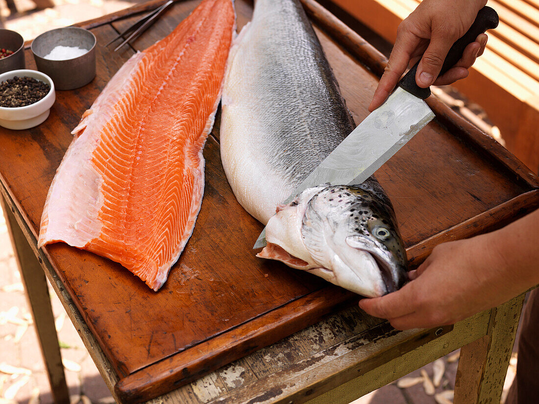 Person Cutting up Fish