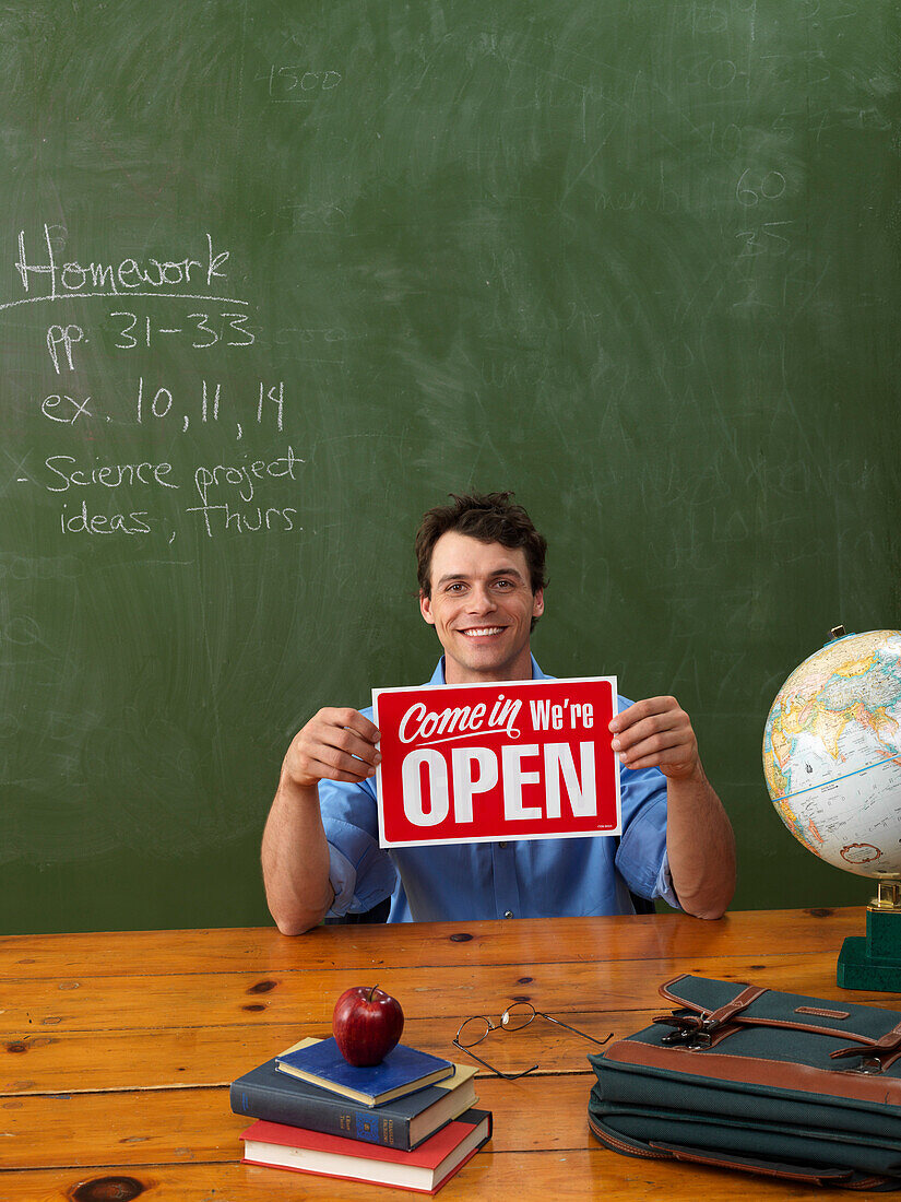 Teacher Holding Open Sign