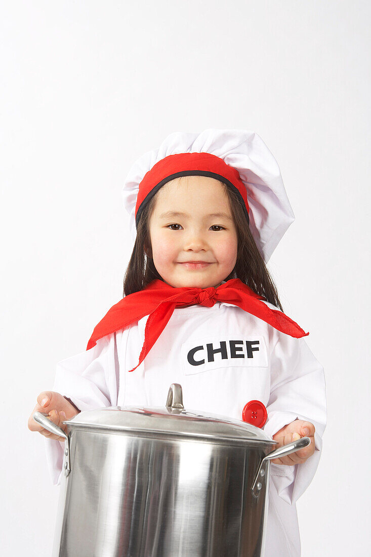 Little Girl Dressed Up as a Chef Holding a Pot
