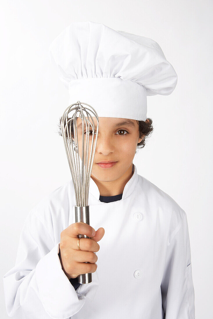 Boy Dressed Up as a Chef Holding a Whisk