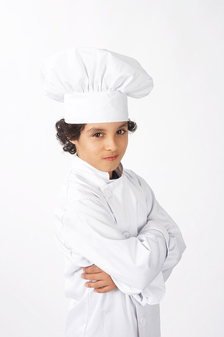 Junge als Koch verkleidet