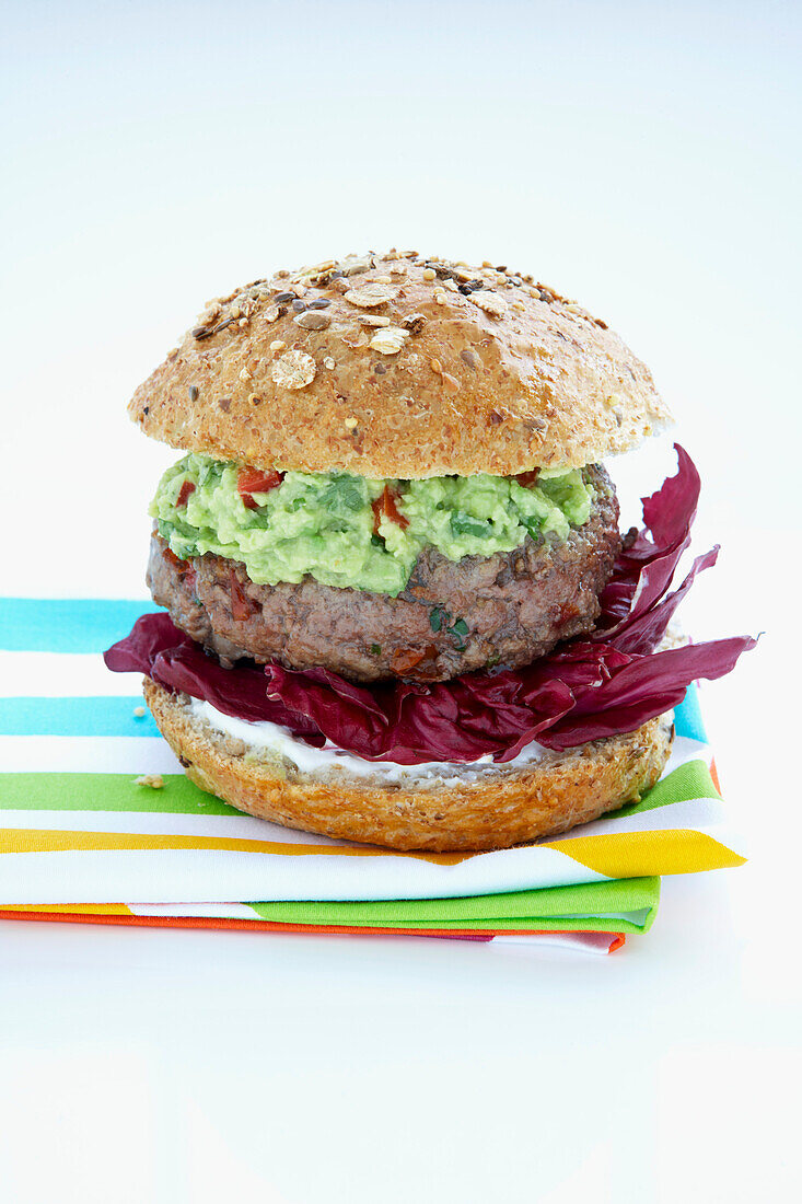 Burger with Salsa and Guacamole on Whole Grain Bun