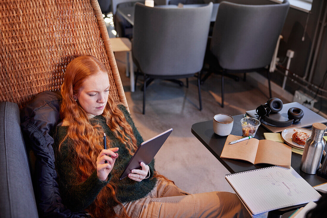 Young woman studying in cafe