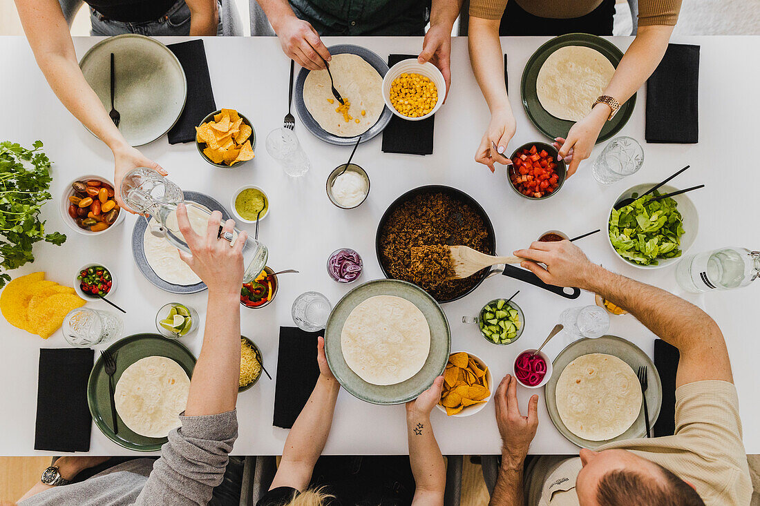 Overhead view of people having Mexican food