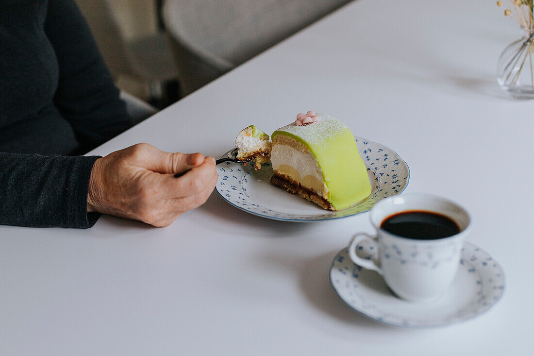 View of person eating cake