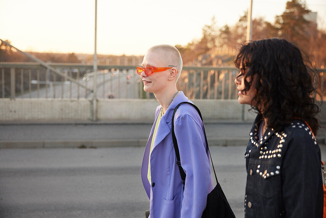 Smiling young women walking together