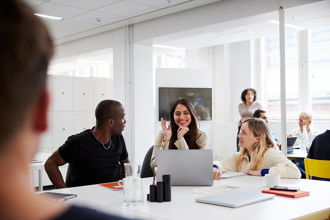 Group of business people discussing project in office