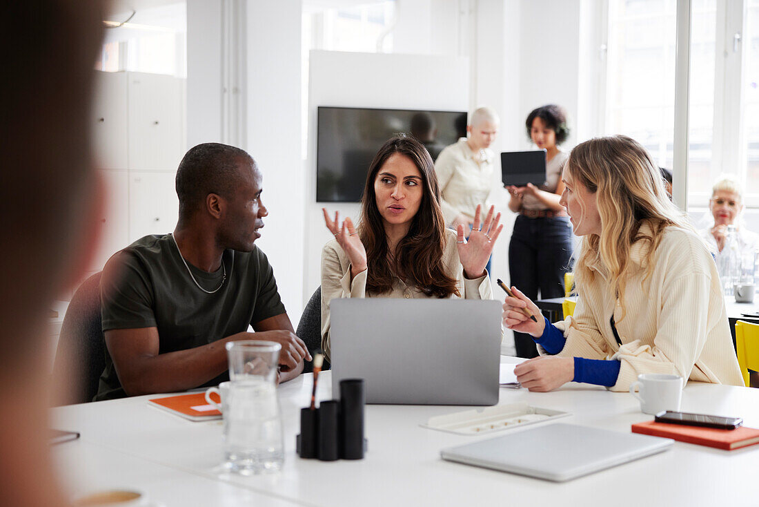 Group of business people discussing project in office