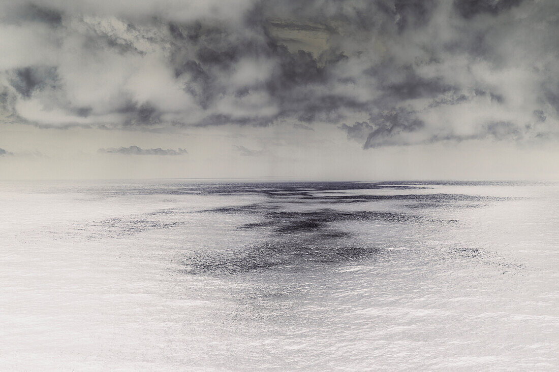 Abstract of Pacific Ocean, view to the horizon and storm clouds. 