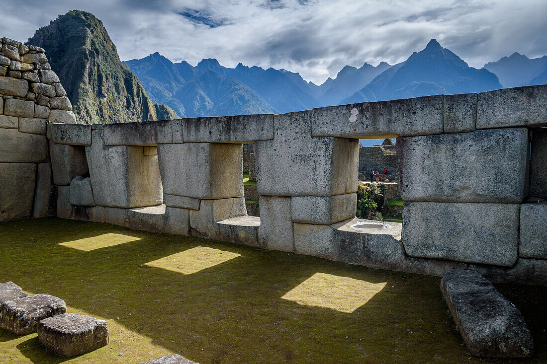 The path to Machu Picchu, the high mountain capital of the Inca tribe, a 15th century citadel site, buildings and view of the plateau and Andes mountains. 