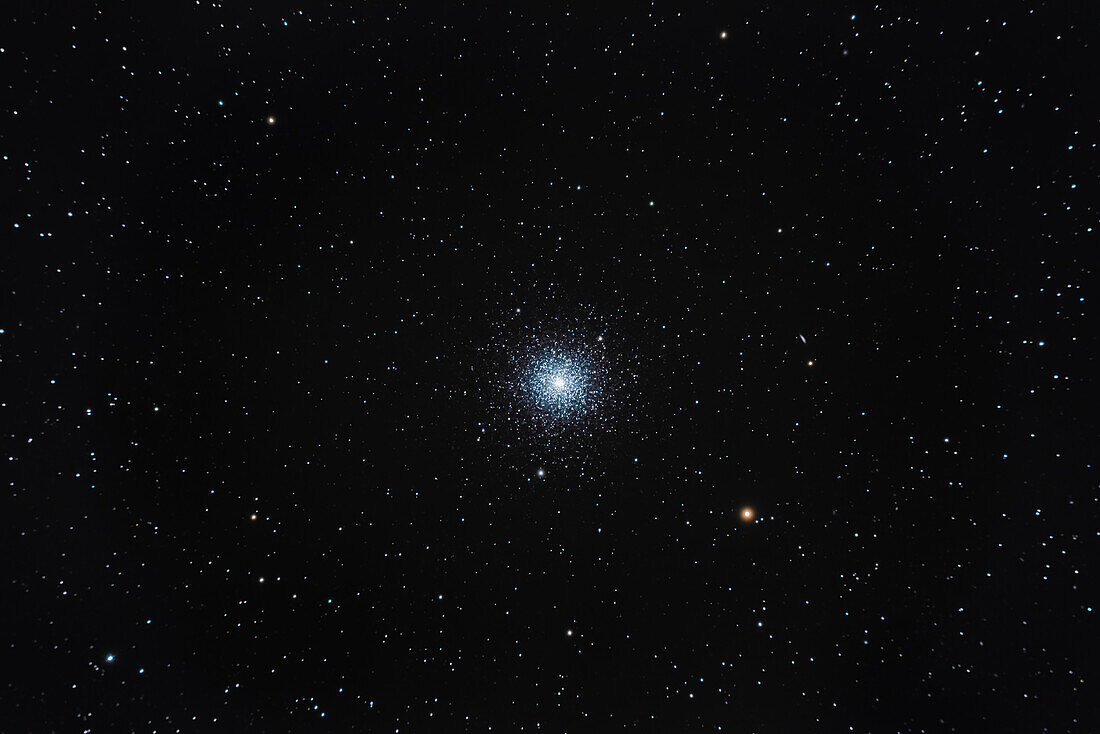 This is Messier 3, the globular cluster in Canes Venatici, one of the brightest globulars in the northern sky. It was discovered by Charles Messier in 1764, but not resolved into stars until 1784 by William Herschel. The little galaxy above the orange star is 14th magnitude NGC 5263.