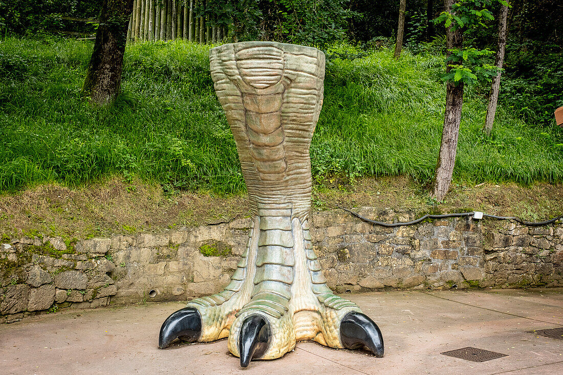 Karpin Fauna. Reproduction of a Tyrannosaurus Rex leg life-size in the area of the terrasauro in the wildlife center Karpin Fauna, Basque country, Spain. Karpin Fauna is a wildlife center that aims to give dignified lives to animals from illegal traffic, abandoned exotic pets and others of similar origin to raise awareness of this problem also has a terrasauro in which you can know some of the life-size dinosaur species that inhabited the land 65 million years ago.