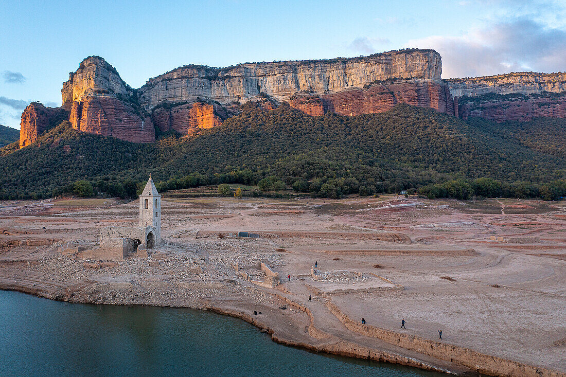 Sau reservoir and Sant Romà de Sau church during a drought, Osona, Barcelona, Spain