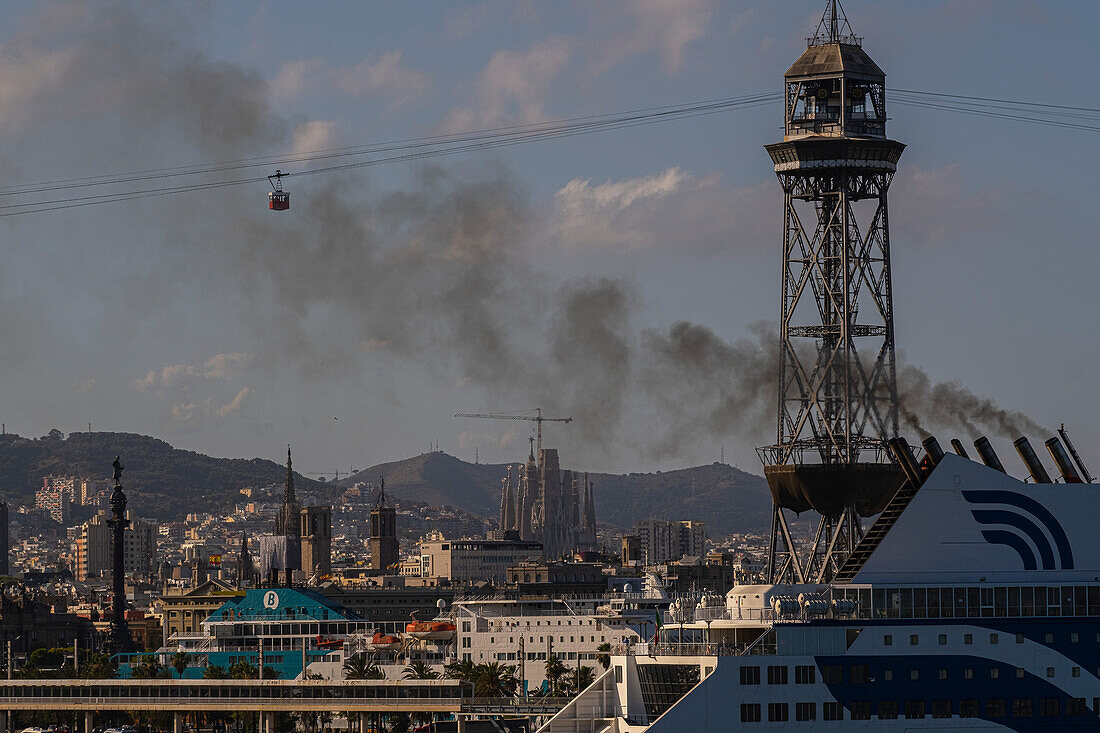 Cruise ship in the port of Barcelona expelling smoke, Barcelona, Spain