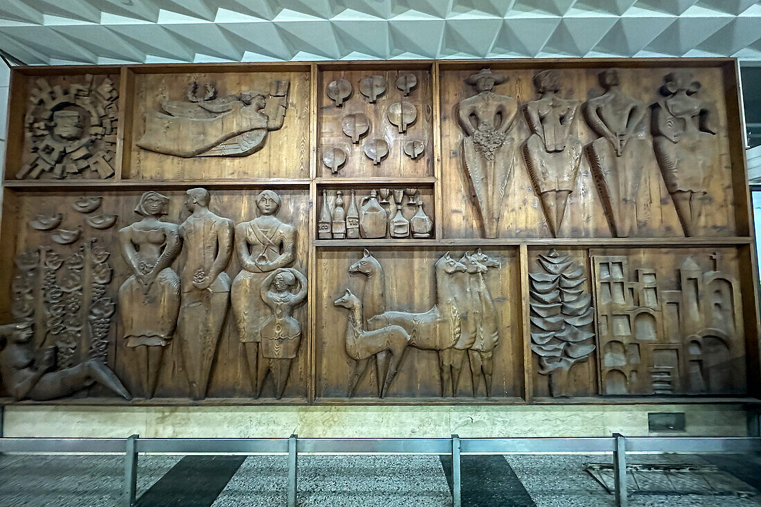 A carved wooden mural in a shopping area in the city of San Juan, Argentina.