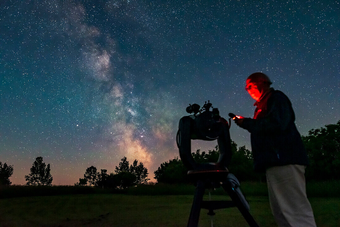 A selfie of me operating the Celestron C8 GoTo system to find targets, for a book illustration. Taken July 21, 2019 from the backyard on a very clear night just before moonrise.,