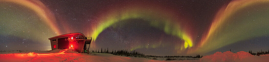 A 300° panorama of an aurora from the Churchill Northern Studies Centre, in Churchill, Manitoba on February 26, 2022. This aurora was at Kp1 level (very low) and appeared only as featureless grey arcs to the eye. But the camera picked up unusual red colouration, and even some yellow-oranges, along with the more normal greens. The reds are odd for such a low-level aurora as the oxygen reds typically appear only when the aurora gets very active and energetic. The display did brighten more later this night when it took on the more classic green arcs, with occasional lower fringes of nitrogen pink