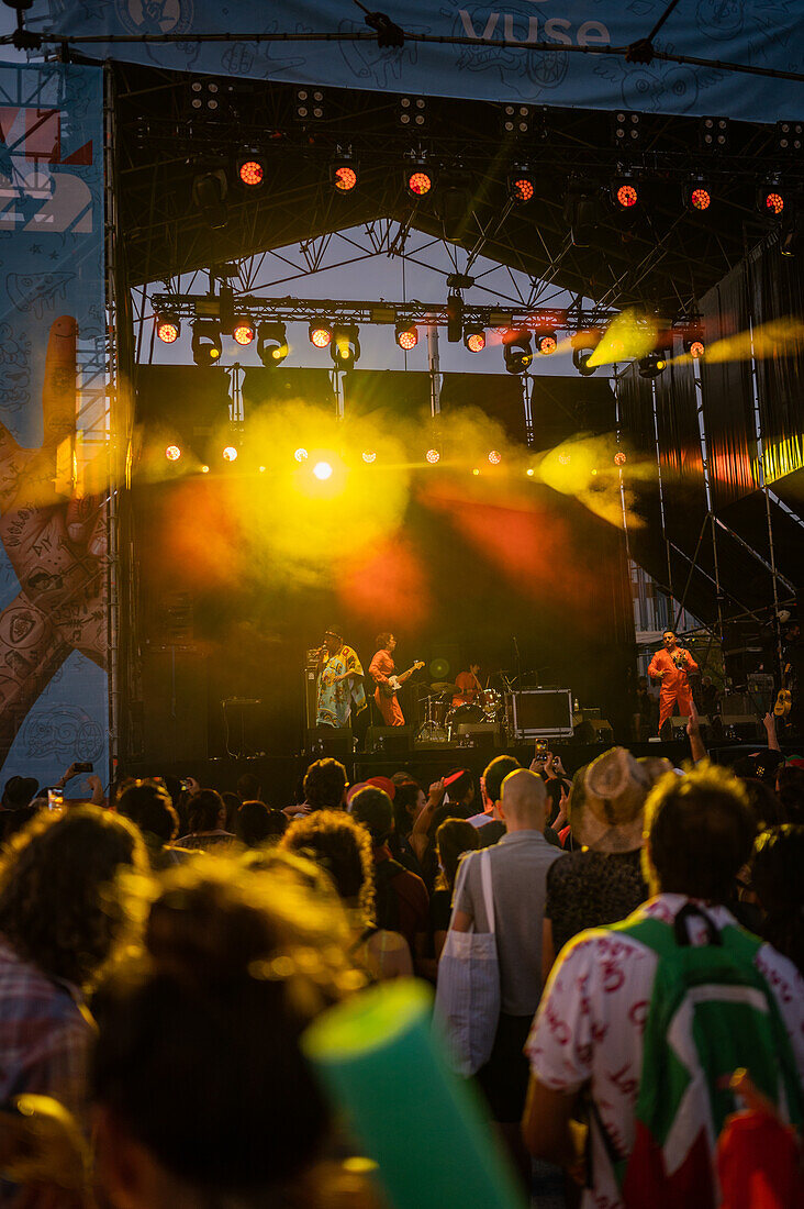 Crowd listens and dances with Mexican band Instituto Mexicano del Sonido during Vive Latino 2022 Music Festival in Zaragoza, Spain