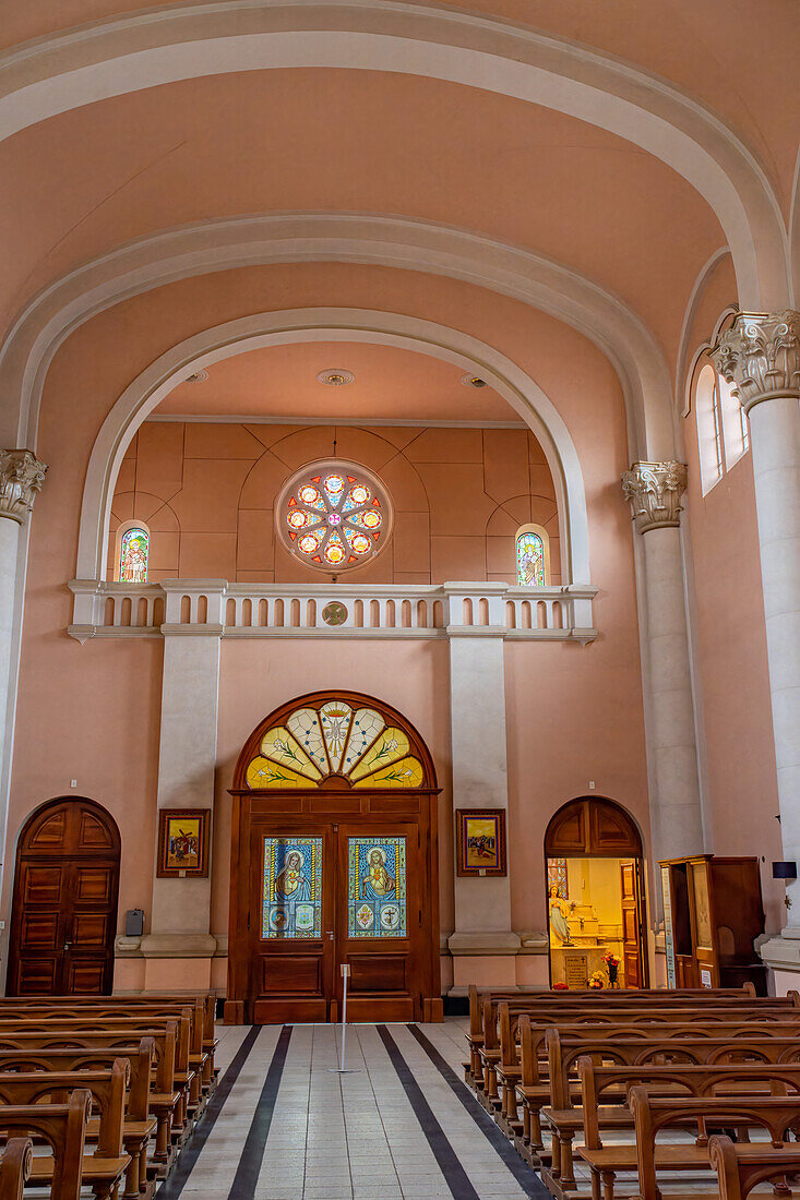 The nave, rose window, stained glass doors and choir of the San Rafael Archangel Cathedral in San Rafael, Argentina.