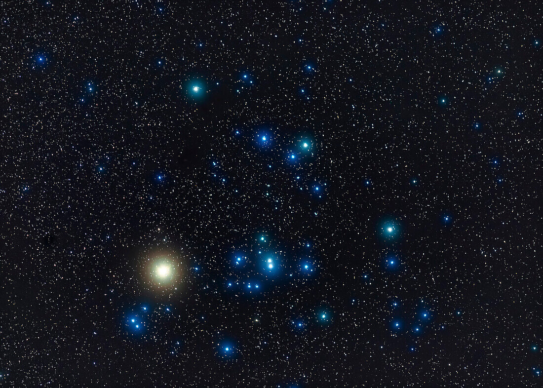 The Hyades star cluster with the red giant star Aldebaran (looking yellow here) in Taurus the bull in the winter sky. The field is similar to what a pair of large binoculars would show. I shot this from home Nov. 25, 2019.