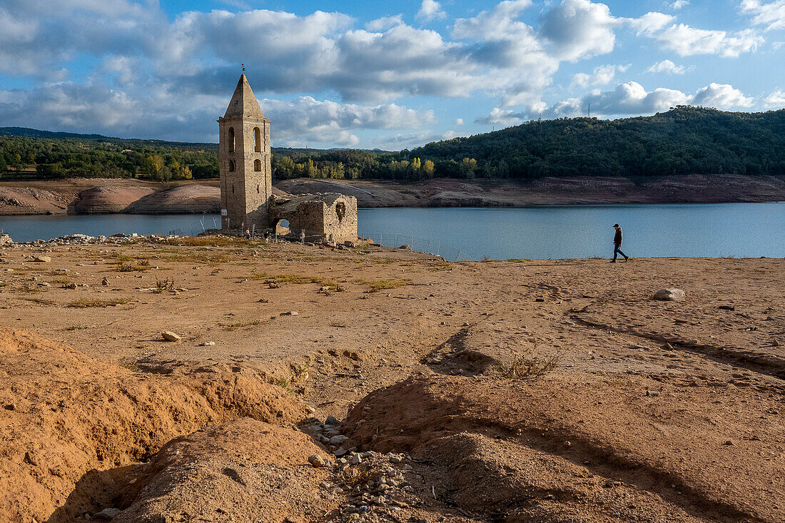 Sau reservoir and Sant Romà de Sau church during a drought, Osona, Barcelona, Spain