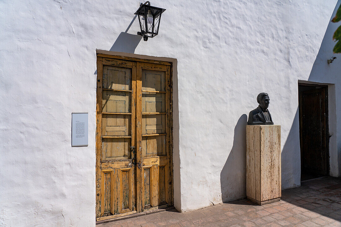 Antique carved wooden doorway in the Birthplace Museum of Domingo F. Sarmiento in San Juan, Argentina.