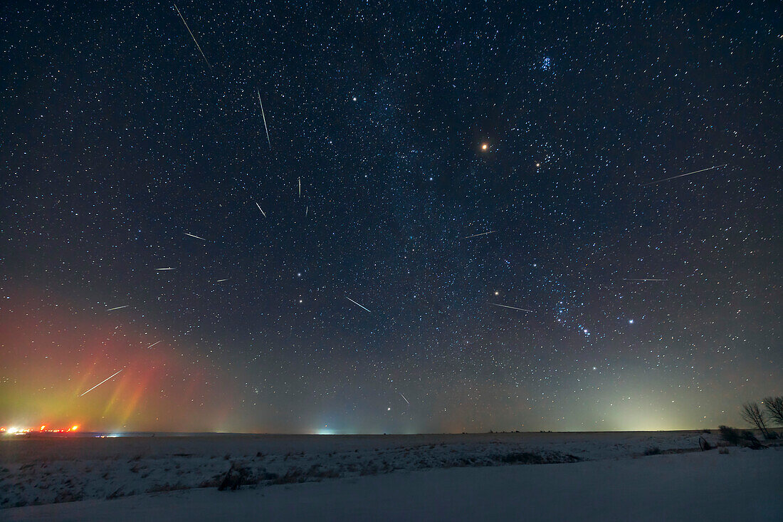 The Geminid meteor shower of 2022, showing the radiant point in Gemini at left, above the stars Castor and Pollux. Orion is at lower right. Mars in Taurus is at top, to the left of Aldebaran and the Hyades star cluste, and below the Pleiades.