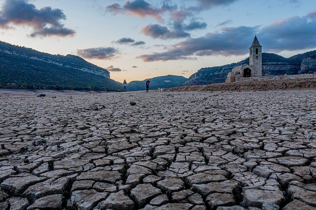 Sau reservoir and Sant Romà de Sau church during a drought, Osona, Barcelona, Spain