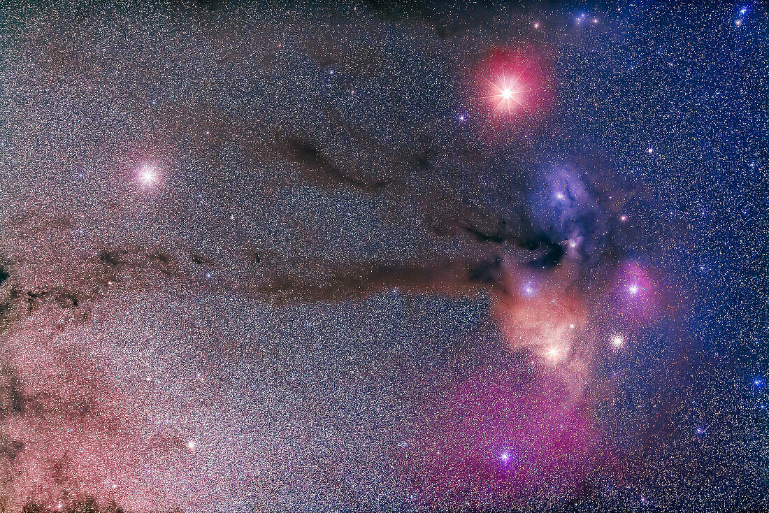 Mars (at top) and Saturn (at left) in Scorpius (or thereabouts - Saturn is technically in Ophiuchus) above Antares and the dark and reflection nebulas around Antares. The globular M4 is visible to the right of Antares.