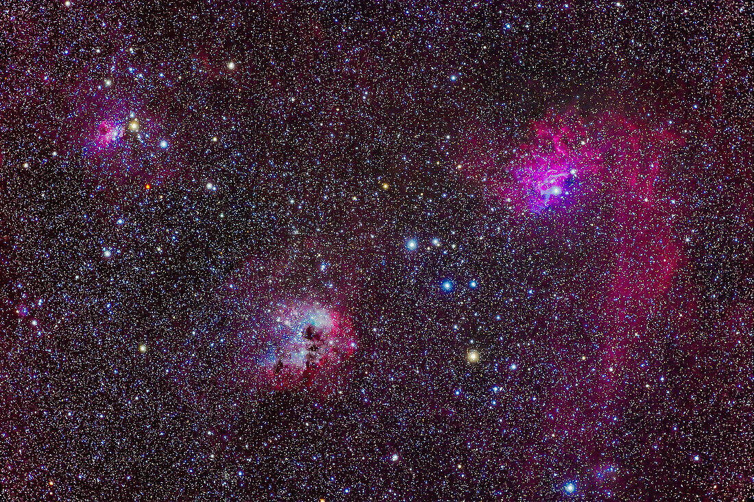 This is a framing of the rich array of nebulas in central Auriga. The complex of star cluster Stock 8 and IC 417 is at upper left. The large nebula at lower centre is IC 410 with the star cluster NGC 1893 embedded in it. The large nebula at right is IC 405, aka the Flaming Star Nebula, with a mix of red emission and blue reflection nebulosity.