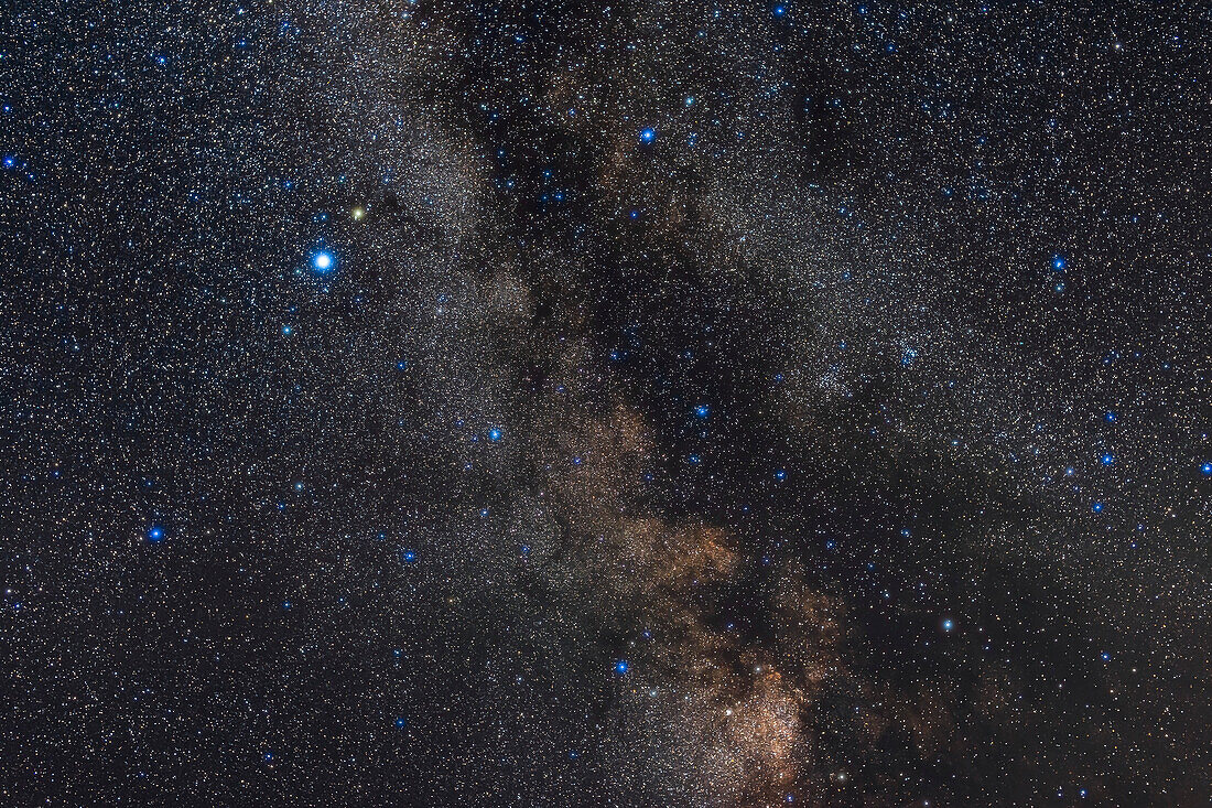 The constellation of Aquila the Eagle with the small constellation of Scutum the Shield below, with its bright starcloud, in the northern summer sky, with parts of Serpens and Ophiuchus at right. The Serpens-Ophiuchus Double Cluster is at right, made of NGC 6633 (right) and IC 4756 (left). Altair is the bright star at left.