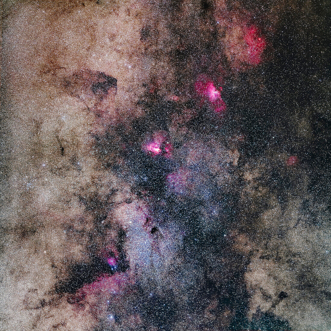 A mosaic of the rich region in Sagittarius and southern Serpens, from the Small Sagittarius Starcloud (Messier 24) at bottom to Messier 16, the Eagle Nebula, at top, with a fainter nebula above it around the cluster NGC 6604. At centre is the Swan or Omega Nebula, Messier 17. The dark nebula below centre is Barnard 92.