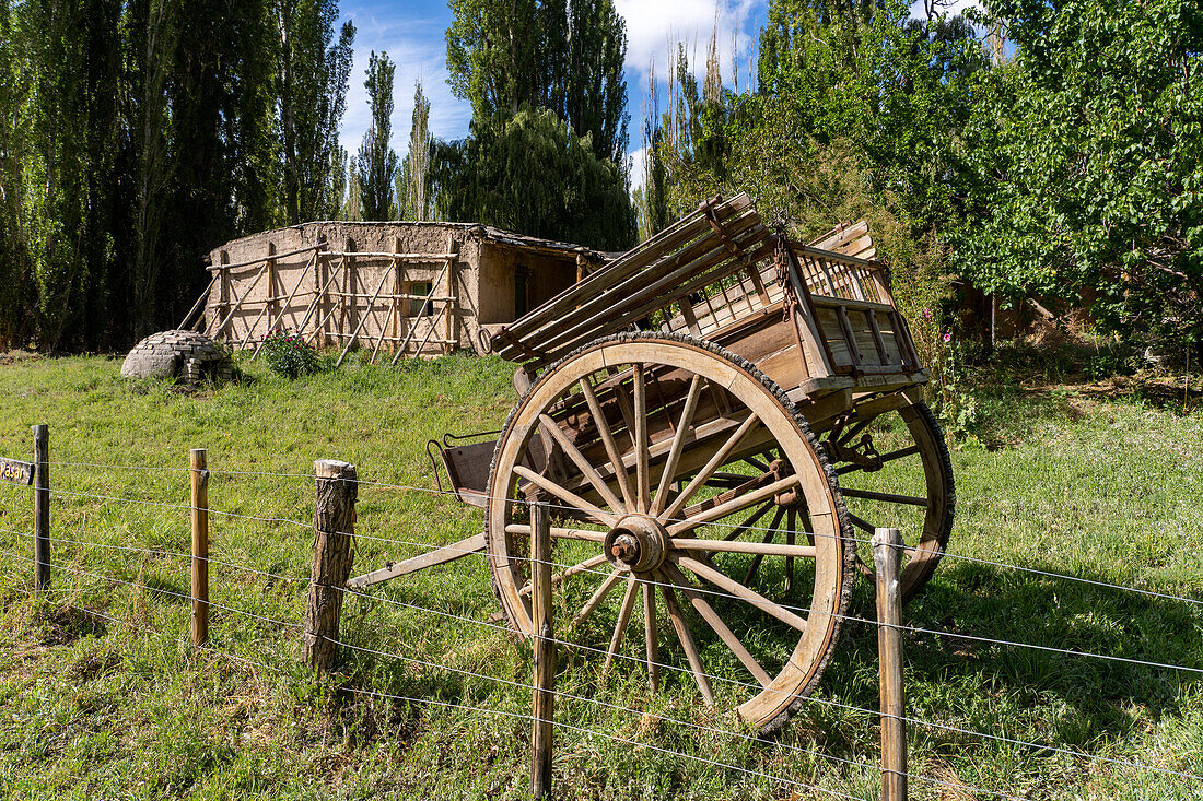 A horsecart in front of the ruins of an adobe ranch building of the old Estancia El Leoncito in El Leoncito National Park in Argentina.