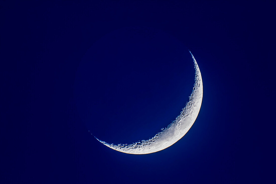 The 4-day-old waxing crescent Moon on April 8, 2019 in a single exposure when the Moon was still in the bright blue twilight. Even so, the faint Earthshine is just becoming visible.