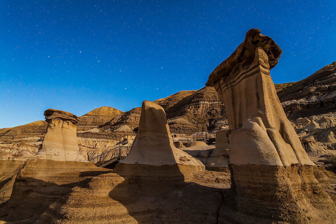The Hoodoos in the Red Deer River valley on Highway 10 east of Drumheller. Taken September 21, 2013 with the Canon 5D MkII and 24mm lens with a single 30-second exposure. Light from waning gibbous Moon provided the illumination.