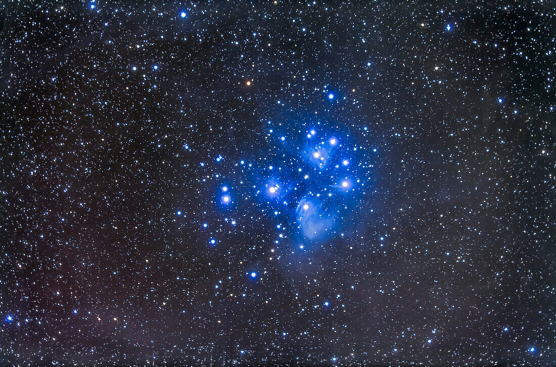 The Pleiades star cluster, aka Seven Sisters, or M45, in Taurus. A deep exposure showing the reflection nebulosity which fills the area. This is a stack of 5 x 14 minute exposures with the TMB 92mm apo refractor and Borg 0.85x flattener/reducer at f/4.8 and Canon 5D MkII at ISO 800. Taken from home Oct 9/10, 2013.