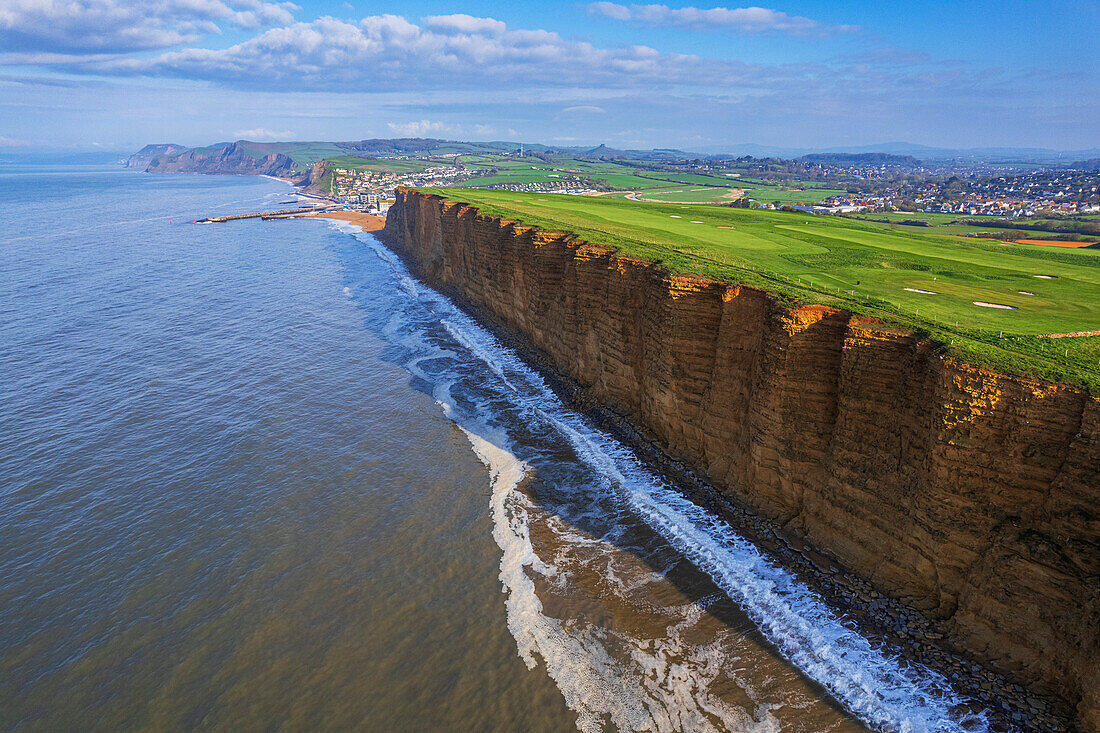 Aerial morning view of the West Bay cliffs on coastline of the Jurassic Coast, UNESCO World Heritage Site, Dorset, England, United Kingdom, Europe