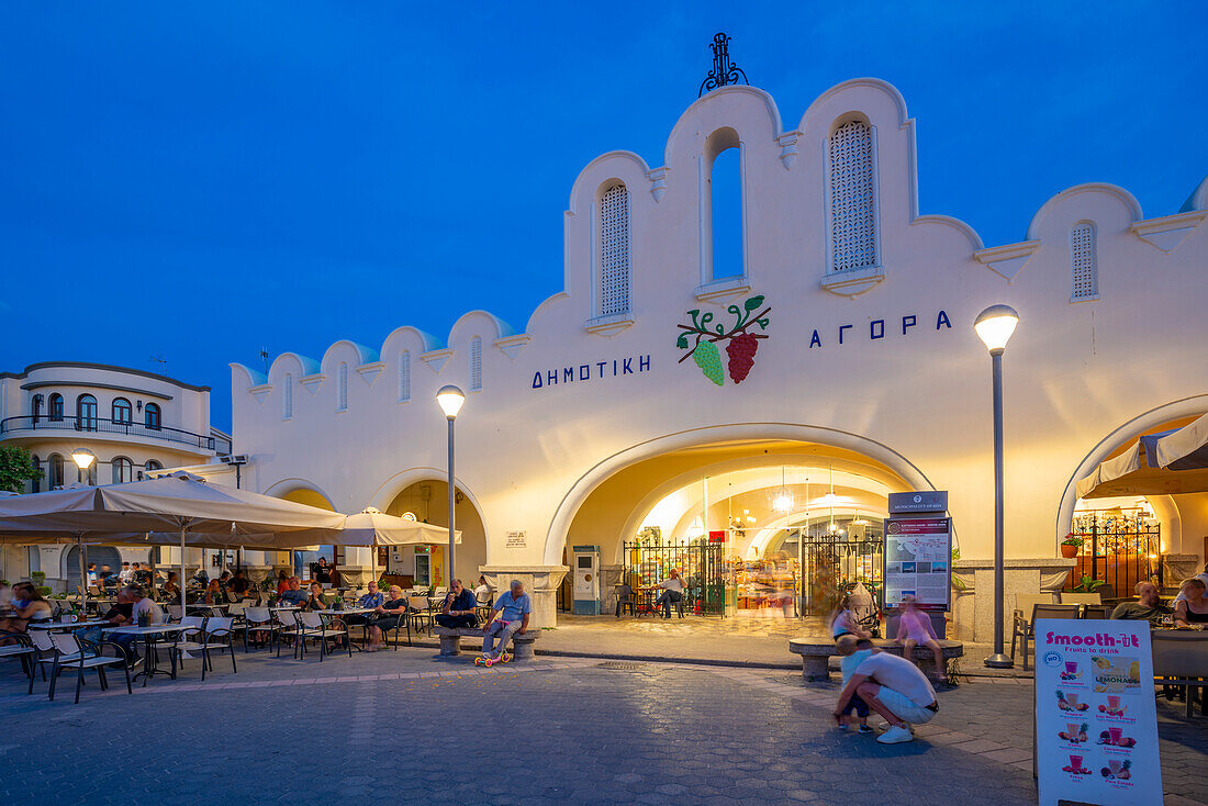 View of Kos Municipal Market in Eleftherias Central Square in Kos Town at dusk, Kos, Dodecanese, Greek Islands, Greece, Europe