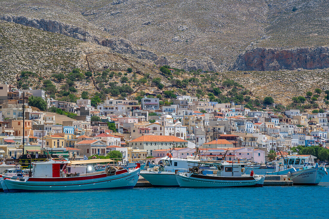 View of port and town of Kalimnos with hills in the background, Kalimnos, Dodecanese Islands, Greek Islands, Greece, Europe