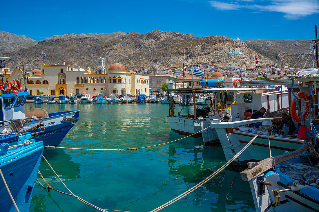 View of harbour boats in Kalimnos with hills in the background, Kalimnos, Dodecanese Islands, Greek Islands, Greece, Europe